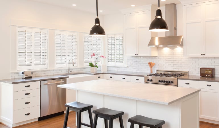 Plantation shutters in a bright San Antonio kitchen.